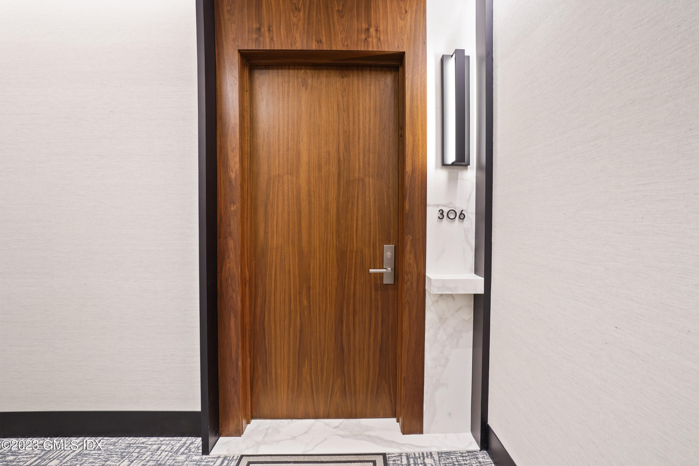 89 River Road, Unit 306 Cos Cob, CT 06807 - Photo 2 of 27 a view of wooden door