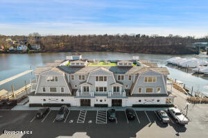 89 River Road, Unit 306 Cos Cob, CT 06807 - Photo 23 of 27 a view of a lake with a mountain view