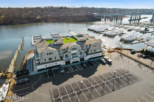 89 River Road, Unit 306 Cos Cob, CT 06807 - Photo 24 of 27 a view of a lake with outdoor seating