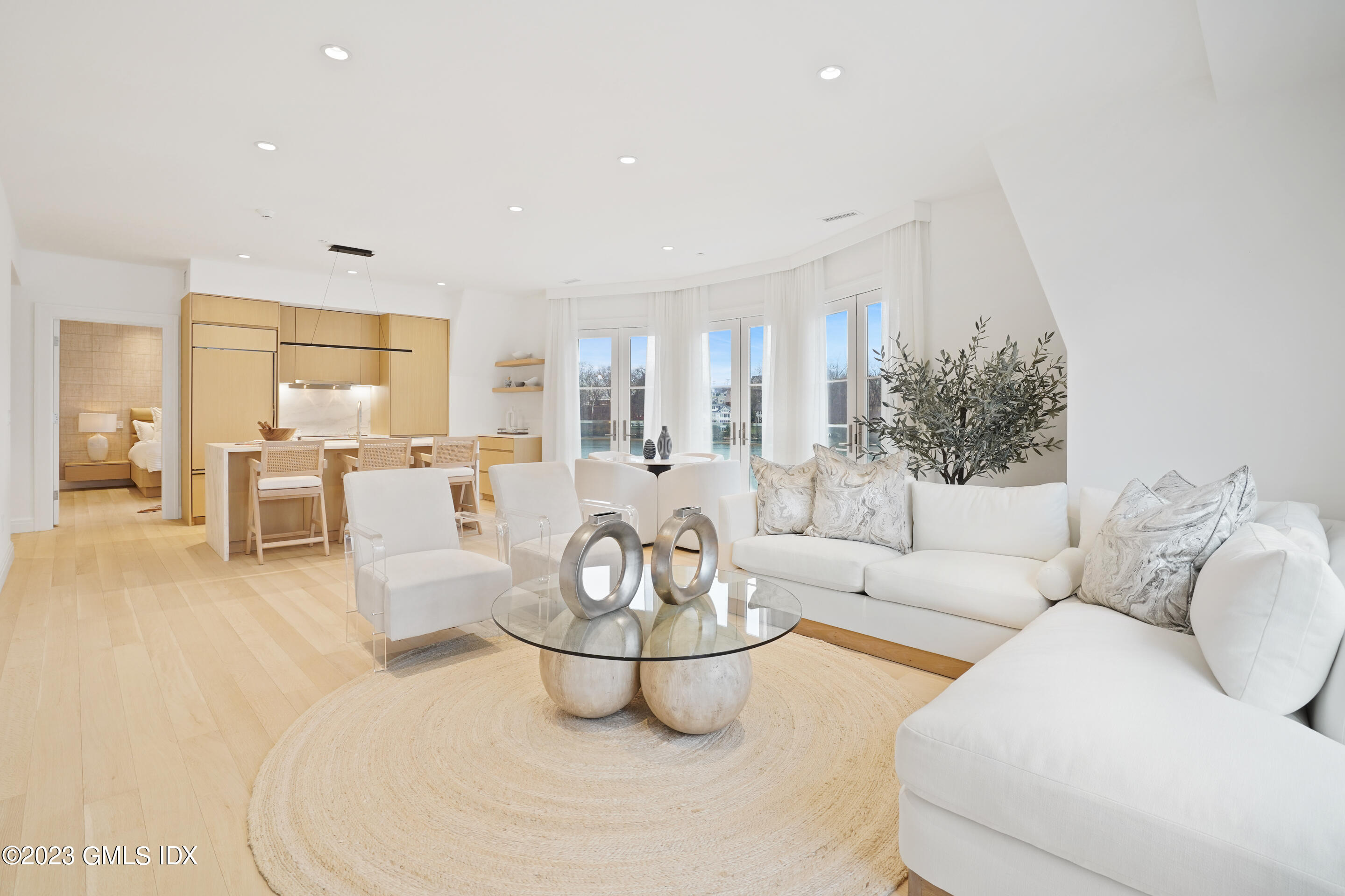 89 River Road, Unit 306 Cos Cob, CT 06807 - Photo 4 of 27 a living room with furniture and a large window