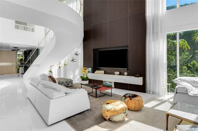 a kitchen with stainless steel appliances a stove a sink and a refrigerator