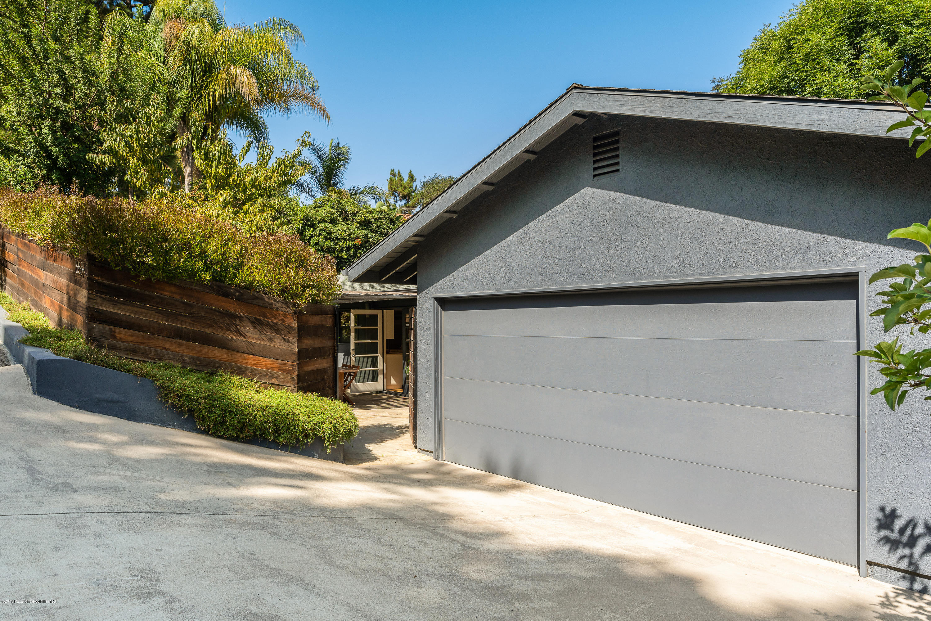 1655 Pleasant Way Pasadena, CA 91105 - Photo 1 of 37 a front view of a house with a yard and garage