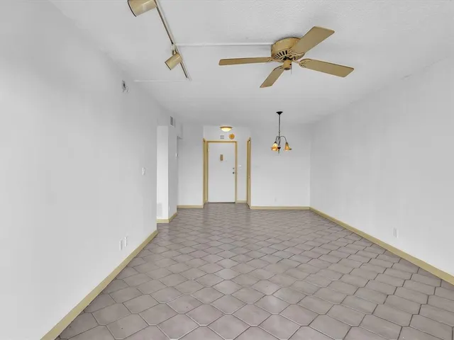 a view of a ceiling fan and a ceiling fan