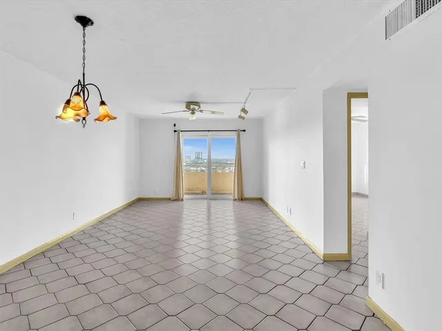 a view of empty room with windows