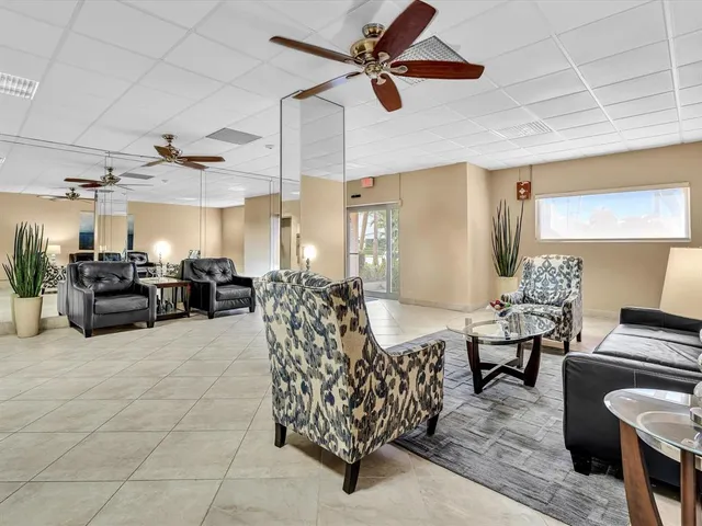 a view of a livingroom with furniture and a chandelier