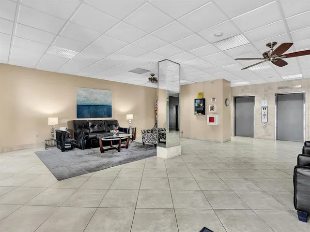 a view of swimming pool with a table and chairs