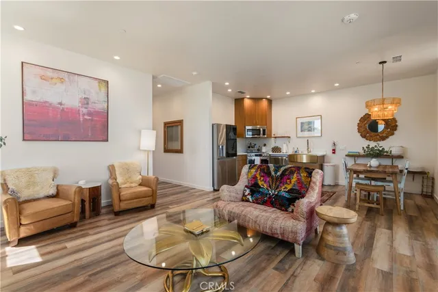 a kitchen with stainless steel appliances a refrigerator and cabinets