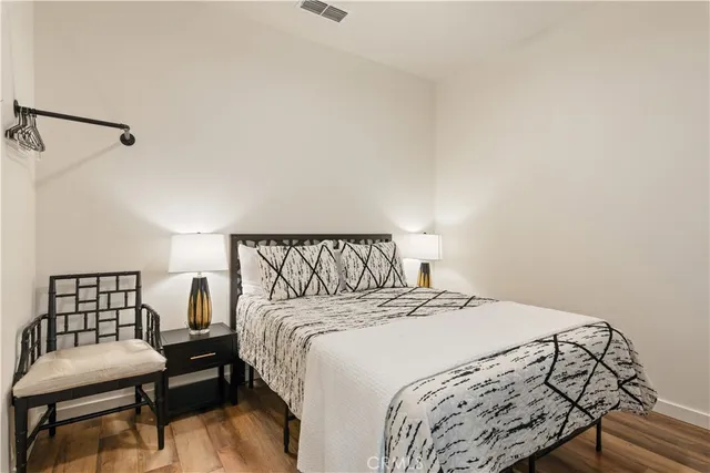 a living room with lots of furniture and kitchen view