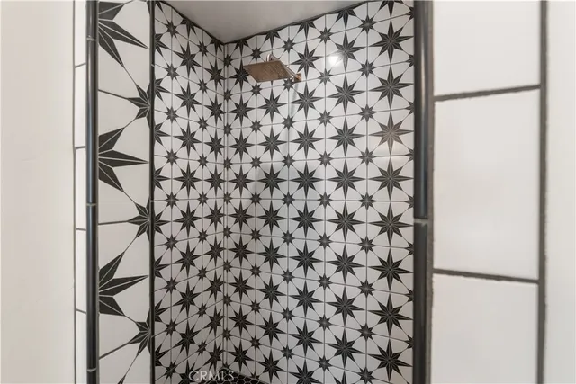 a kitchen with stainless steel appliances granite countertop a refrigerator sink and stove