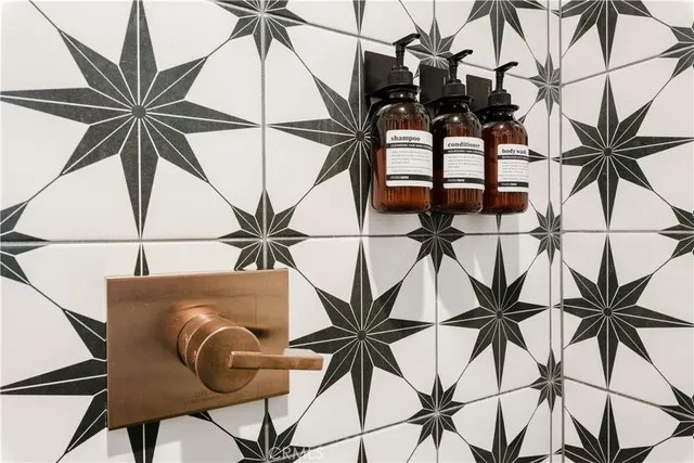 a kitchen with stainless steel appliances a sink a stove and microwave