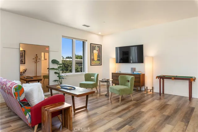 a bedroom with a bed and a wall painting