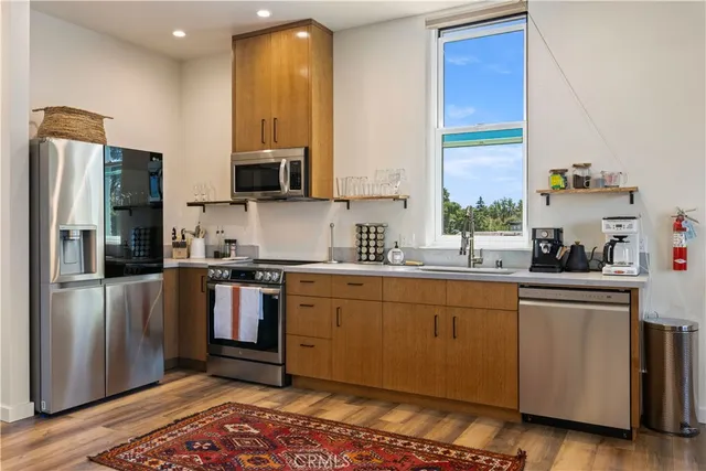 a view of a two chairs and table in the balcony