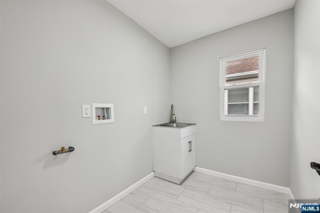 271 North Avenue Wood-Ridge, NJ 07075 - Photo 16 of 18 a view of a room that has a window in it