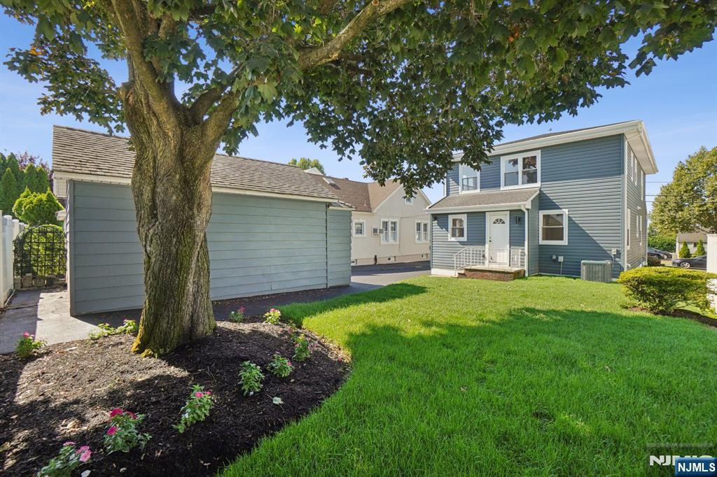 271 North Avenue Wood-Ridge, NJ 07075 - Photo 18 of 18 a front view of house with yard and green space