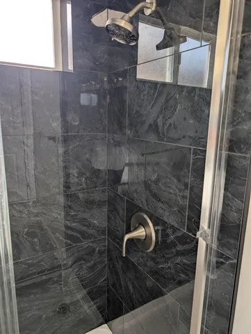 a close view of a shower in bathroom