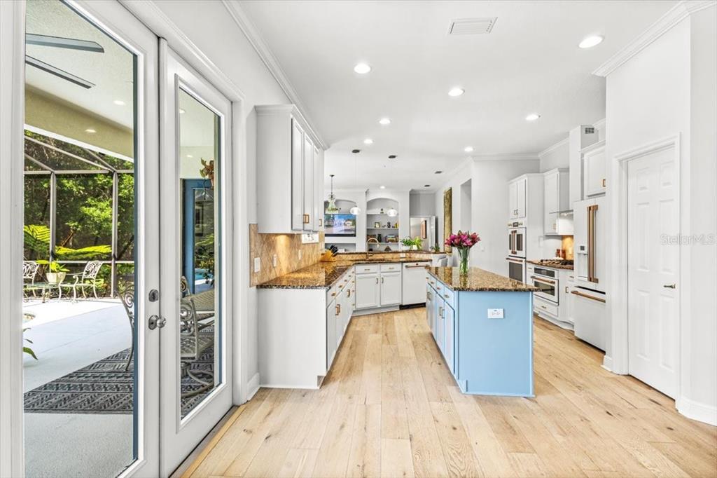 5120 Tari Stream Way Brandon, FL 33511 - Photo 13 of 35 a living room with stainless steel appliances furniture wooden floor and a large window