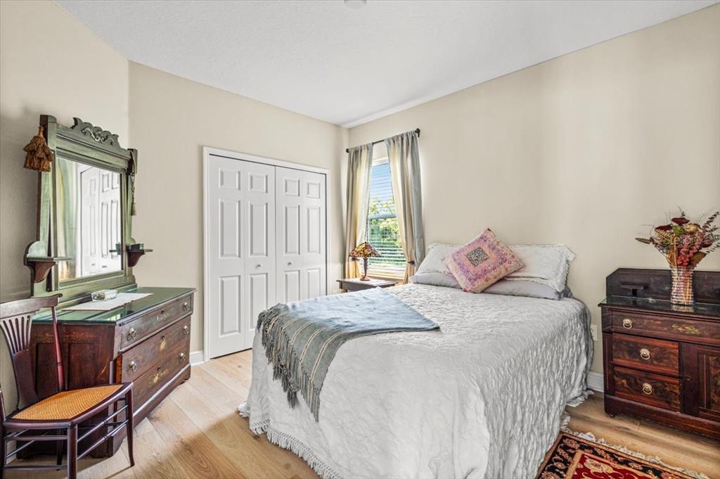 5120 Tari Stream Way Brandon, FL 33511 - Photo 23 of 35 a bedroom with a bed and a dresser