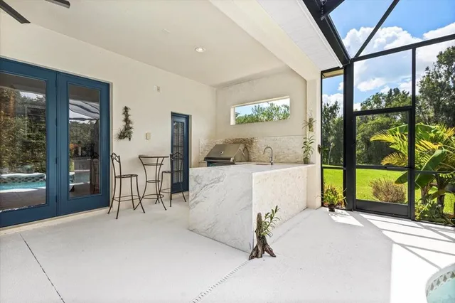 a living room with a large window and table