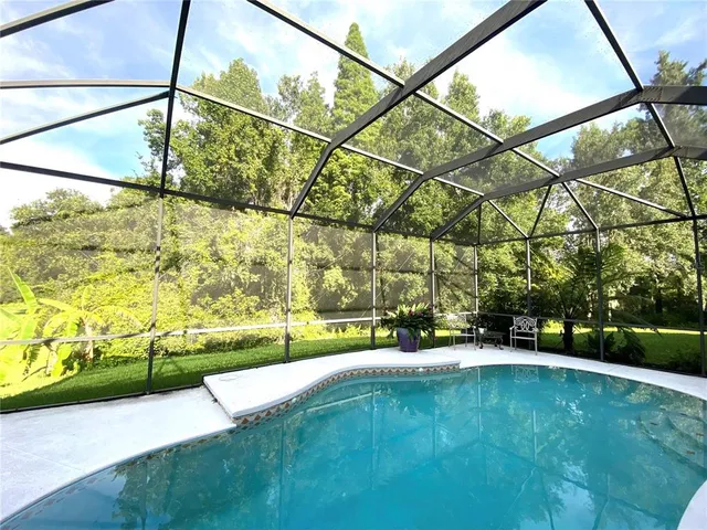a view of a yard with a patio