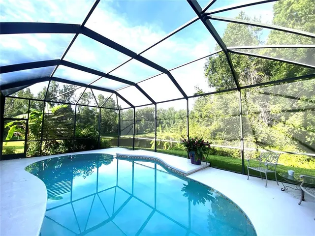 a view of a swimming pool with a porch