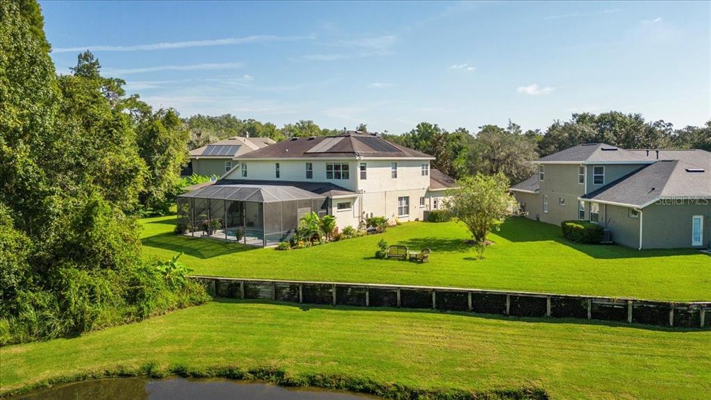 5120 Tari Stream Way Brandon, FL 33511 - Photo 31 of 35 a view of a house with a yard and sitting area
