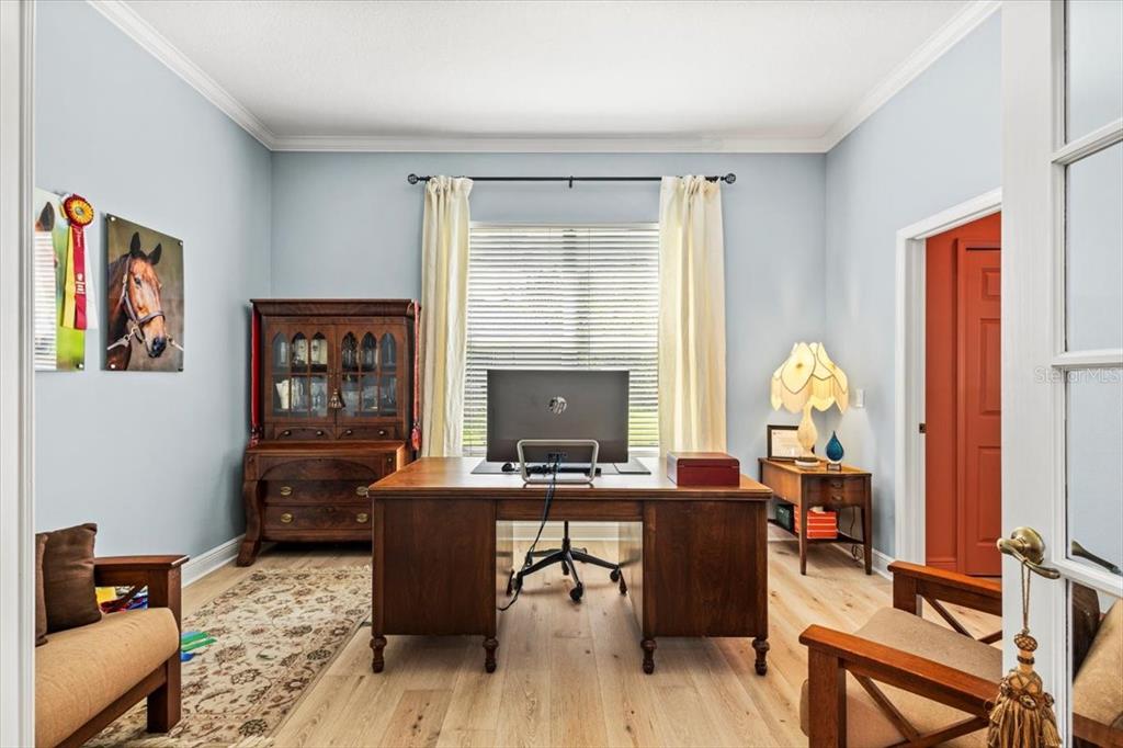 5120 Tari Stream Way Brandon, FL 33511 - Photo 6 of 35 a view of a workspace with furniture and a window