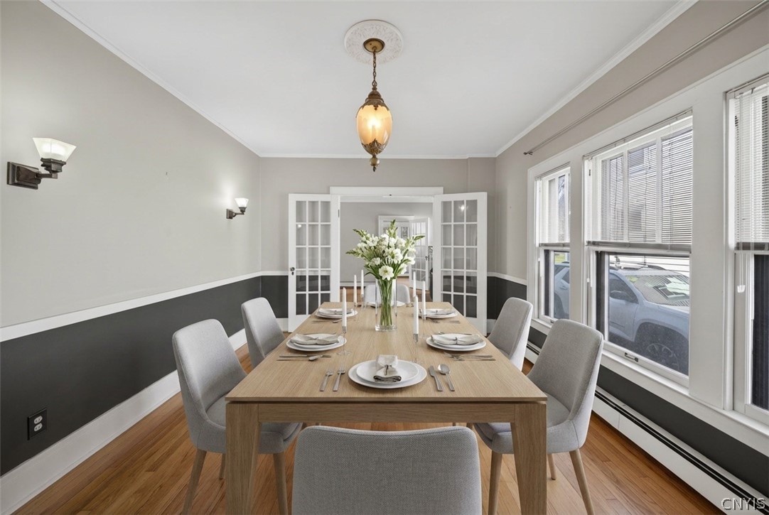 411 Robineau Road Syracuse, NY 13207 - Photo 15 of 50 AI staged dining rm table for visualization purpos