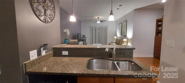 a view of a livingroom with furniture and a chandelier