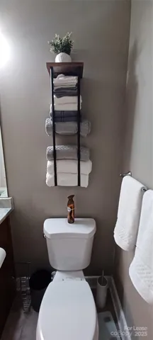 a bathroom with a toilet and a sink