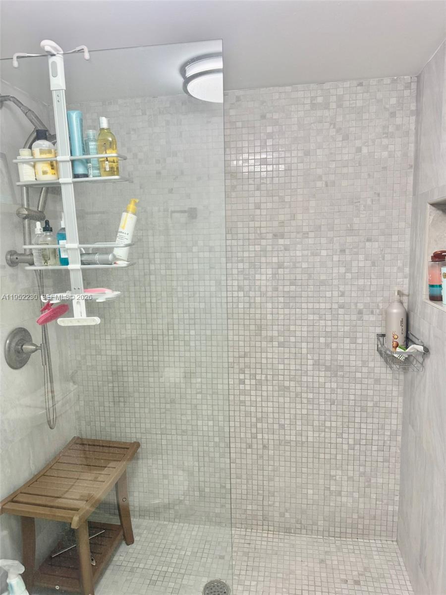 8810 Southwest 123rd Court, Unit M202 Miami, FL 33186 - Photo 21 of 34 a bathroom with a shower
