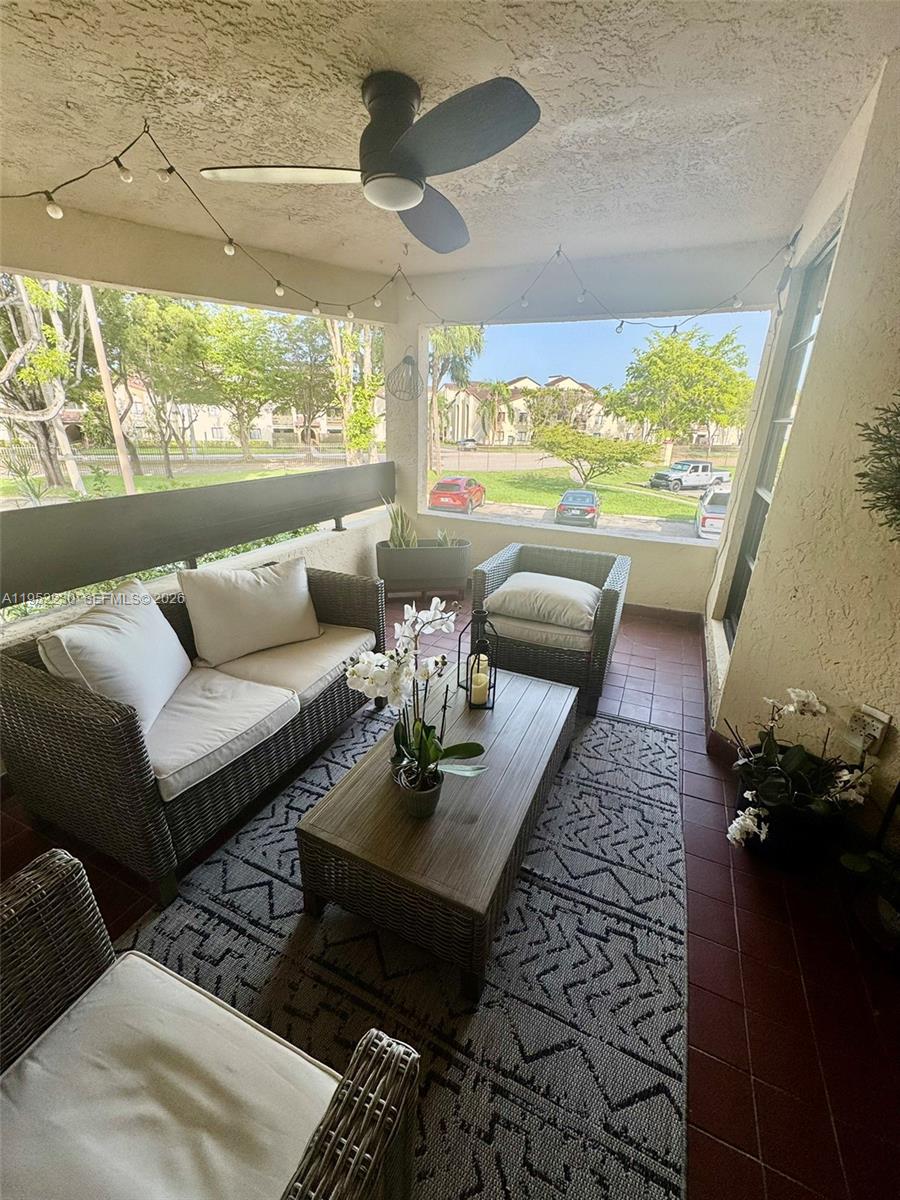 8810 Southwest 123rd Court, Unit M202 Miami, FL 33186 - Photo 34 of 34 a living room with furniture and a large window