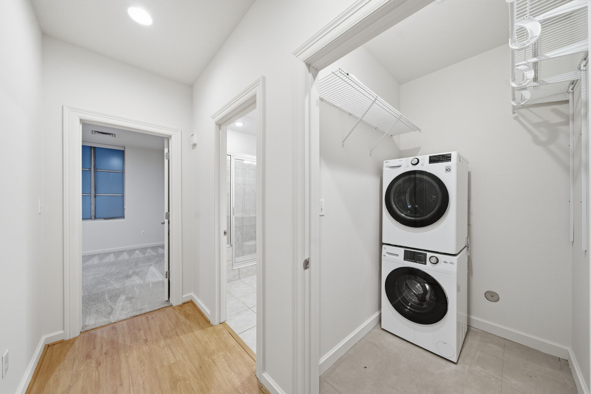 914 Main Street, Unit 704 Houston, TX 77002 - Photo 11 of 22 a view of a hallway with washer and dryer