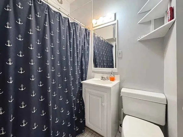 a bathroom with a toilet and a sink