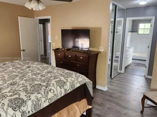a bathroom with a bath tub and shower