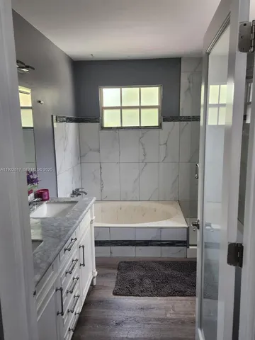 a bathroom with a toilet and a view of bathroom