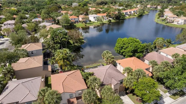 an aerial view of house with yard