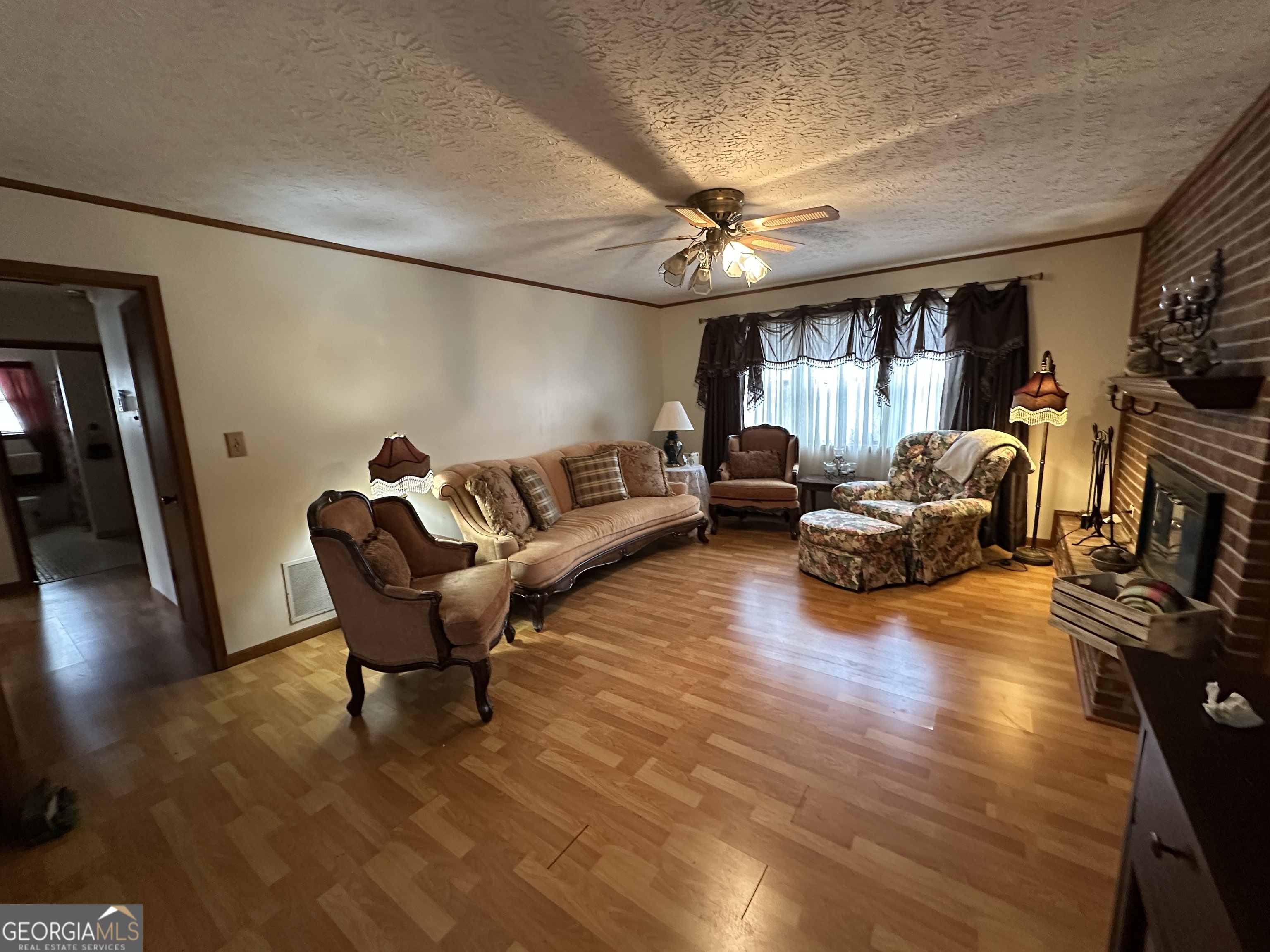 11306 Panhandle Road Hampton, GA 30228 - Photo 13 of 20 a living room with furniture and a large window