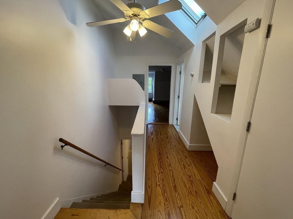36-2 Lowell Avenue, Unit 362 Newton, MA 02460 - Photo 15 of 22 a view of a hallway with wooden floor and staircase