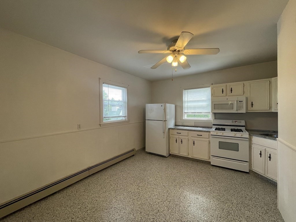 36-2 Lowell Avenue, Unit 362 Newton, MA 02460 - Photo 6 of 22 a kitchen with a stove a sink and dishwasher