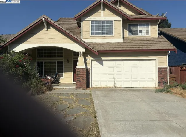 a front view of a house with a garage