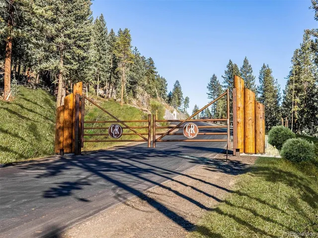 a view of a lush green hillside and a houses