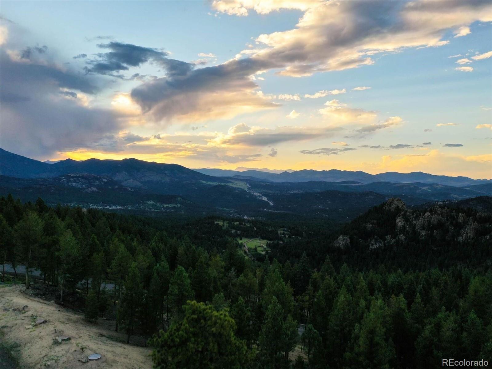 6371 Canyon Creek Road Evergreen, CO 80439 - Photo 32 of 38 a view of city and a lake