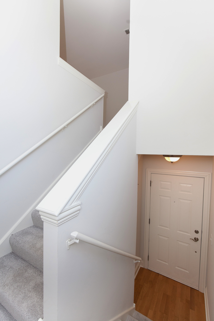 11 Foxcroft Road, Unit 239 Naperville, IL 60565 - Photo 2 of 13 a view of an empty walk in closet