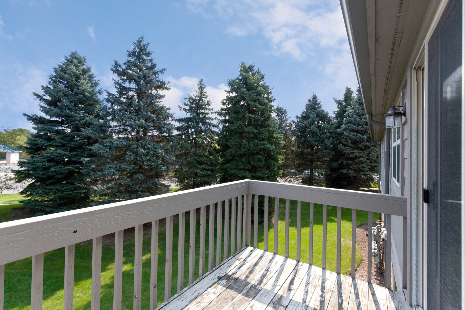 11 Foxcroft Road, Unit 239 Naperville, IL 60565 - Photo 12 of 13 a view of balcony with wooden floor and fence