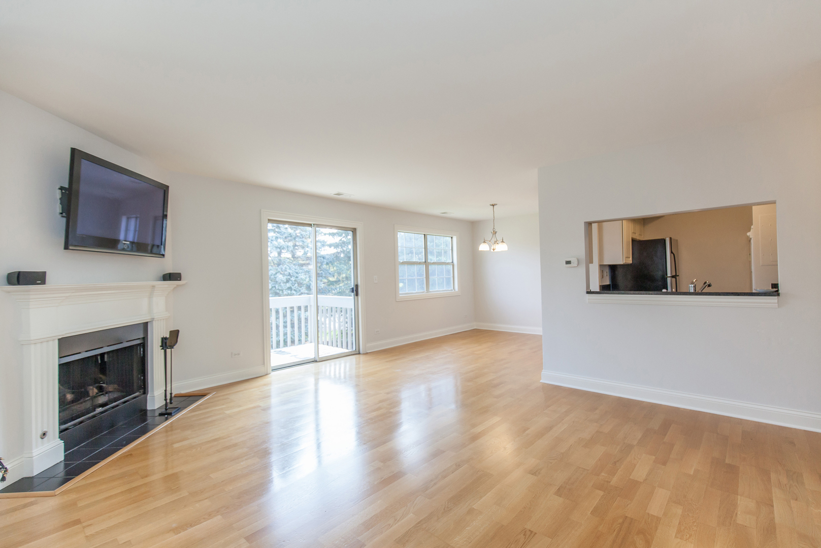 11 Foxcroft Road, Unit 239 Naperville, IL 60565 - Photo 3 of 13 a view of a living room a window and a fireplace