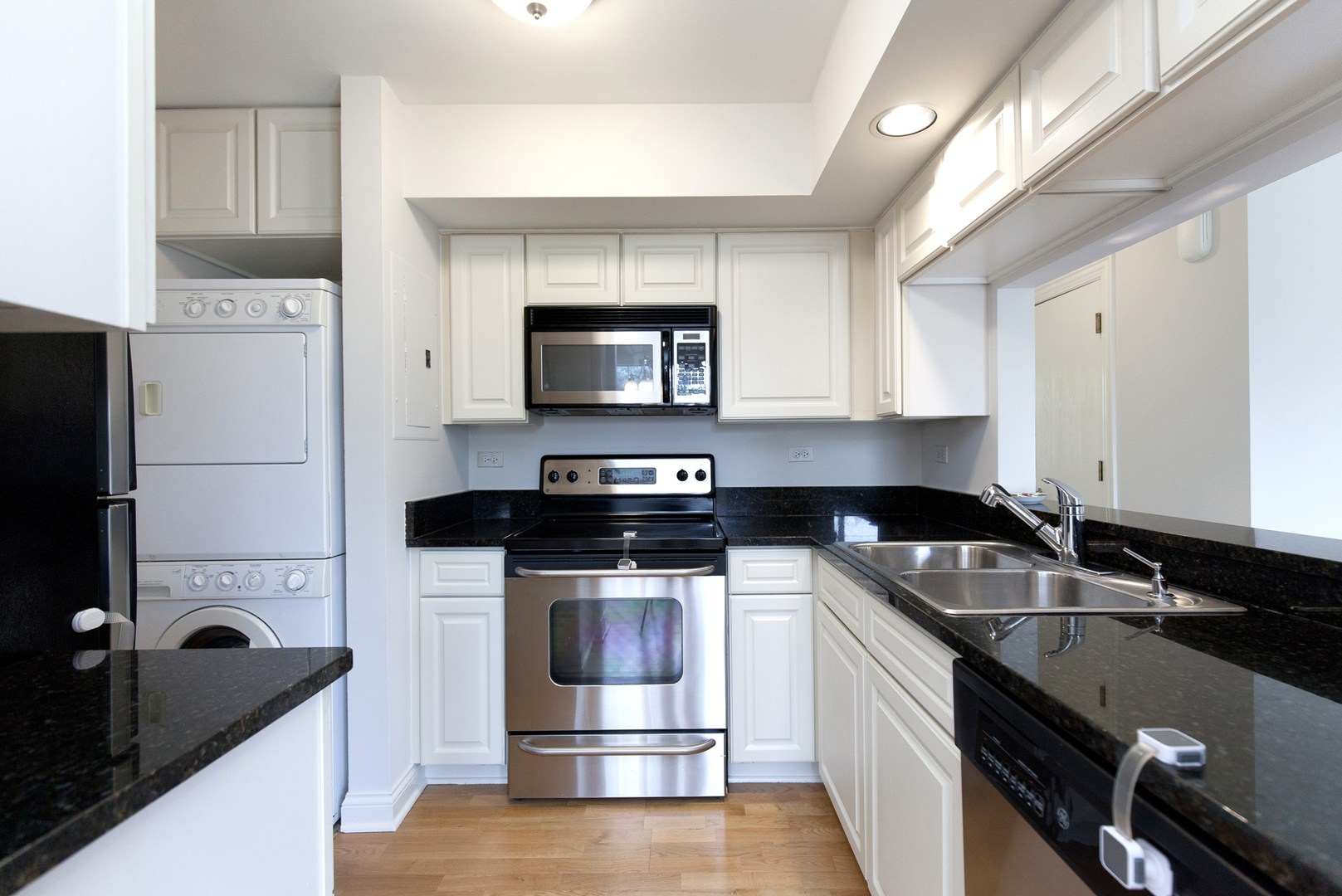 11 Foxcroft Road, Unit 239 Naperville, IL 60565 - Photo 6 of 13 a kitchen with a sink stove and refrigerator