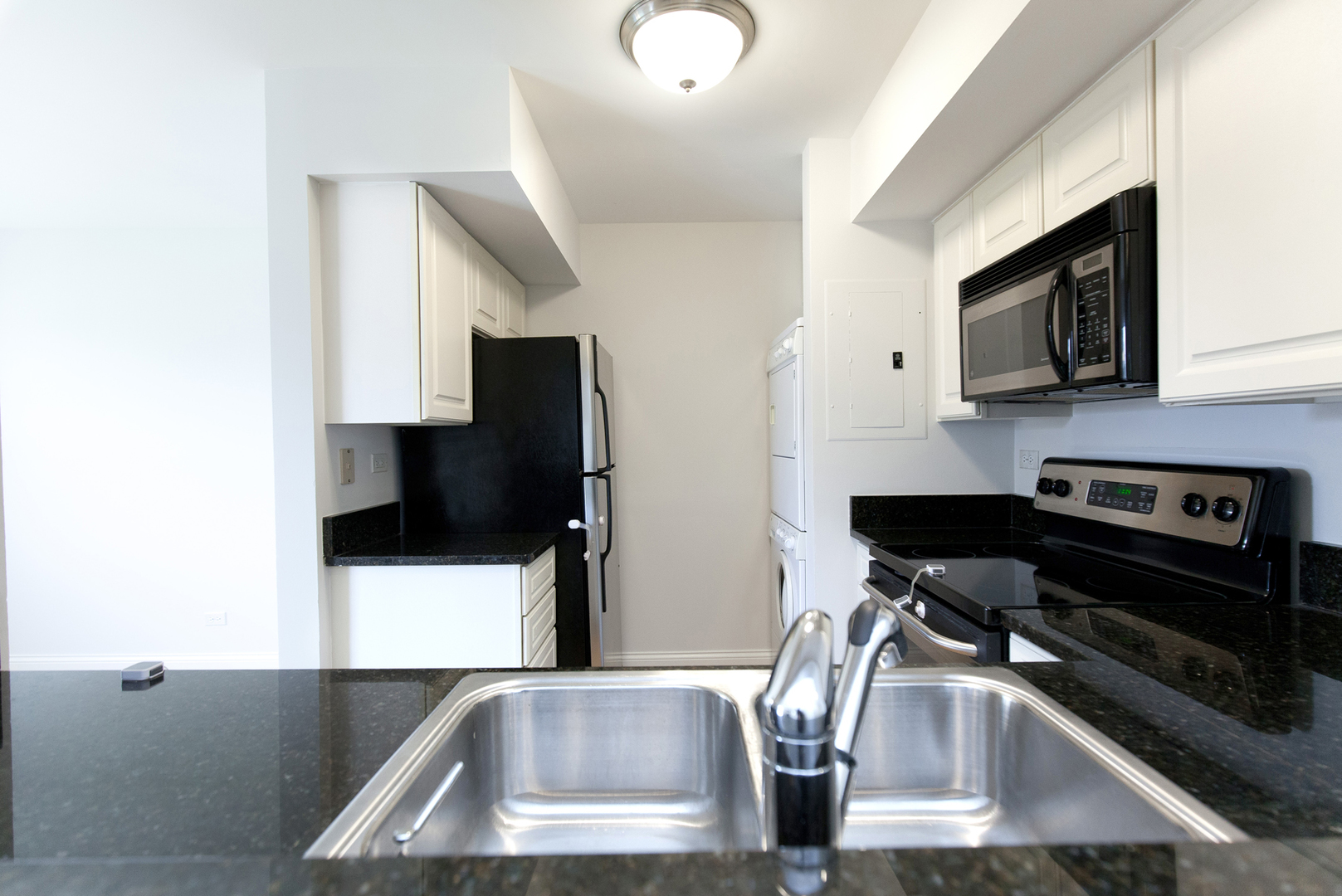 11 Foxcroft Road, Unit 239 Naperville, IL 60565 - Photo 8 of 13 a kitchen with stainless steel appliances granite countertop a refrigerator and a stove top oven