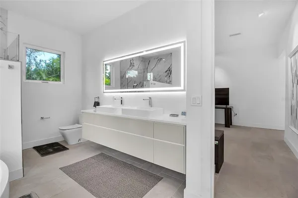 a bathroom with a bathtub and a toilet