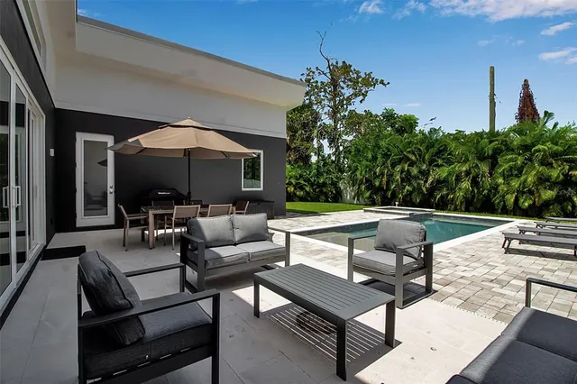 a outdoor living space with furniture and a potted plant