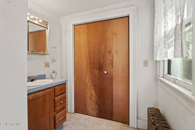 a bed room with a bed and a window